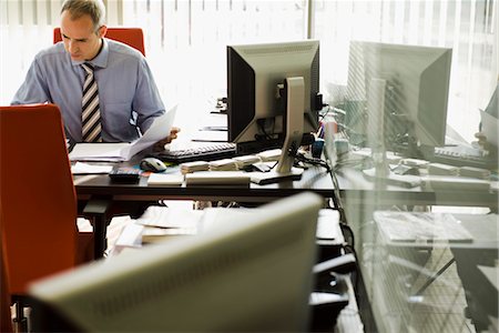 simsearch:632-05400935,k - Businessman working in office Stock Photo - Premium Royalty-Free, Code: 632-03779537