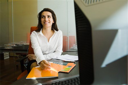 simsearch:632-05401320,k - Smiling businesswoman in office Stock Photo - Premium Royalty-Free, Code: 632-03779560