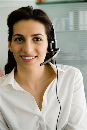 simsearch:632-05401320,k - Businesswoman wearing telephone headset, portrait Stock Photo - Premium Royalty-Free, Code: 632-03779574