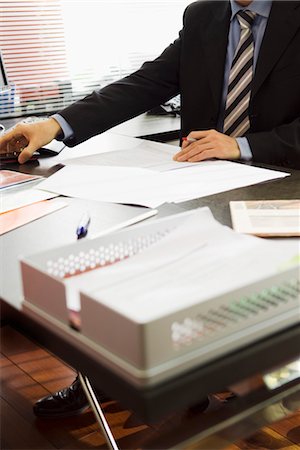 Executive working in office, cropped Stock Photo - Premium Royalty-Free, Code: 632-03779573