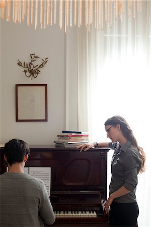 piano practice - Man taking piano lessons Stock Photo - Premium Royalty-Free, Code: 632-03847684