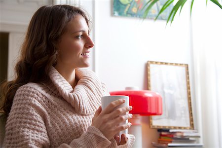 simsearch:632-05401320,k - Young woman enjoying cup of coffee at home Stock Photo - Premium Royalty-Free, Code: 632-03847766
