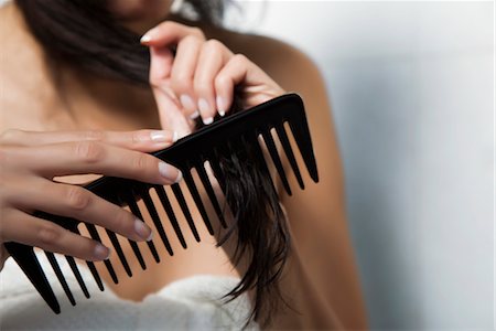 simsearch:632-05760692,k - Woman combing her hair, cropped Stock Photo - Premium Royalty-Free, Code: 632-03847838