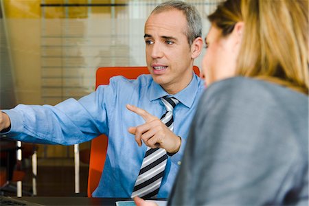 Businessman talking to client Stock Photo - Premium Royalty-Free, Code: 632-03848071