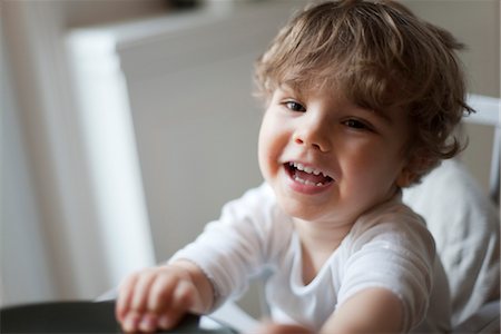 Toddler boy smiling, portrait Stock Photo - Premium Royalty-Free, Code: 632-03848261