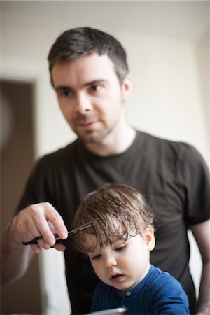 Father cutting toddler son's hair Stock Photo - Premium Royalty-Free, Code: 632-03848297