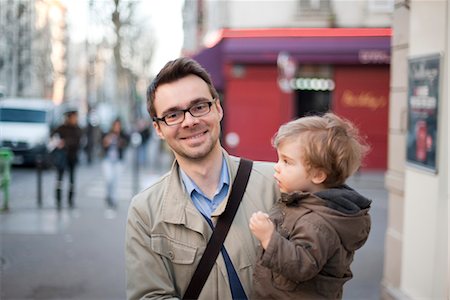 parents - Man carrying toddler son, portrait Stock Photo - Premium Royalty-Free, Code: 632-03848298