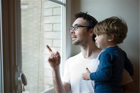 simsearch:632-03848361,k - Father and toddler son looking out window together Stock Photo - Premium Royalty-Free, Code: 632-03848392