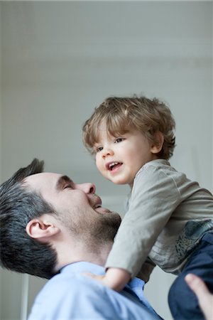 proximity - Father holding up young son, portrait Stock Photo - Premium Royalty-Free, Code: 632-03848426