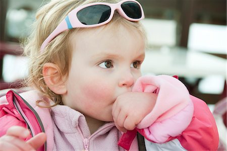 Toddler girl sucking her thumb Stock Photo - Premium Royalty-Free, Code: 632-03897836