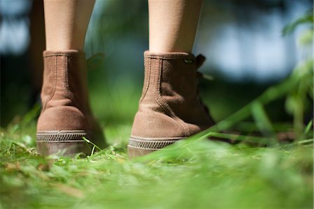 Woman wearing hiking boots outdoors, cropped Stock Photo - Premium Royalty-Free, Code: 633-05401555