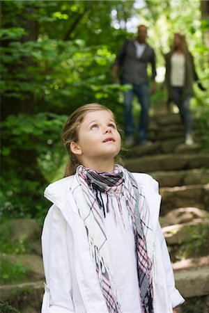simsearch:695-03376367,k - Girl standing in woods, looking up in awe Stock Photo - Premium Royalty-Free, Code: 633-05401810