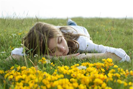 Young woman resting on meadow Stock Photo - Premium Royalty-Free, Code: 633-05402031