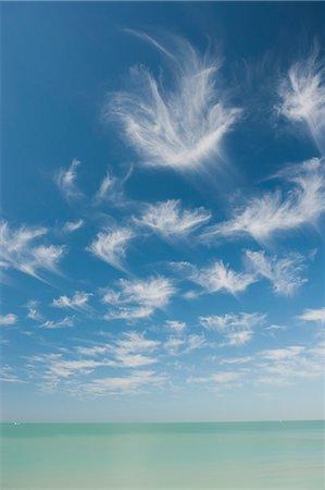 simsearch:633-06322603,k - Wispy clouds over tranquil sea Stock Photo - Premium Royalty-Free, Code: 633-06322579