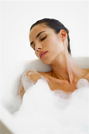simsearch:633-06354677,k - Mid-adult woman relaxing in bubble bath Stock Photo - Premium Royalty-Free, Code: 633-06322608