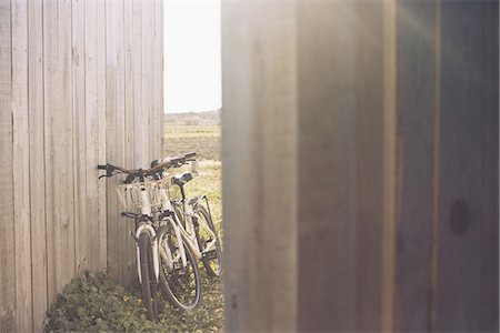 fences - Pair of bicycles leaning against wooden fence Stock Photo - Premium Royalty-Free, Code: 633-08150712