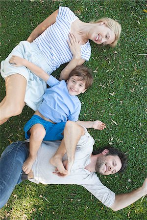 simsearch:673-06964589,k - Young family with boy lying together on grass Stock Photo - Premium Royalty-Free, Code: 633-08151101