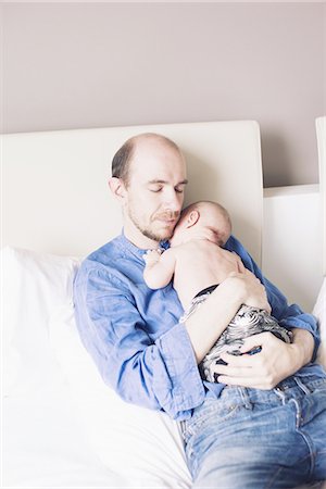 simsearch:6116-07236010,k - Father napping with infant Stock Photo - Premium Royalty-Free, Code: 633-08639068