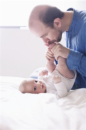 simsearch:6116-07236010,k - Father kissing infant son Stock Photo - Premium Royalty-Free, Code: 633-08639071