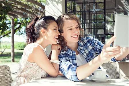 simsearch:632-07674444,k - Young couple taking selfie with digital tablet Stock Photo - Premium Royalty-Free, Code: 633-08726301