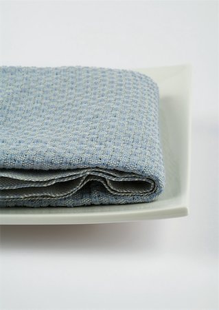 Towel folded on square dish Stock Photo - Premium Royalty-Free, Code: 633-01274098