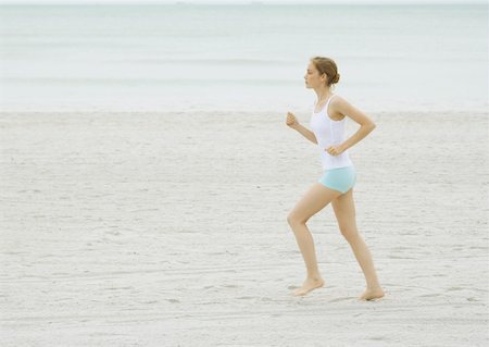simsearch:633-01715682,k - Young woman running on beach Stock Photo - Premium Royalty-Free, Code: 633-01274202