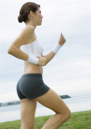 simsearch:633-01715682,k - Young woman running Stock Photo - Premium Royalty-Free, Code: 633-01274869