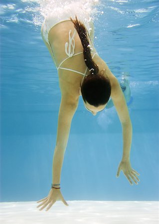 simsearch:633-01714467,k - Teenage girl swimming underwater Stock Photo - Premium Royalty-Free, Code: 633-01274929