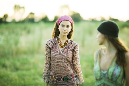 simsearch:859-03983201,k - Young hippie women walking in field Stock Photo - Premium Royalty-Free, Code: 633-01574164