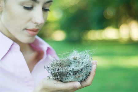 simsearch:633-01272536,k - Woman holding bird's nest in palm of hand Stock Photo - Premium Royalty-Free, Code: 633-01574293
