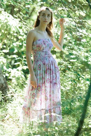 simsearch:633-01574151,k - Young woman wearing dress, standing in woods Stock Photo - Premium Royalty-Free, Code: 633-01573211