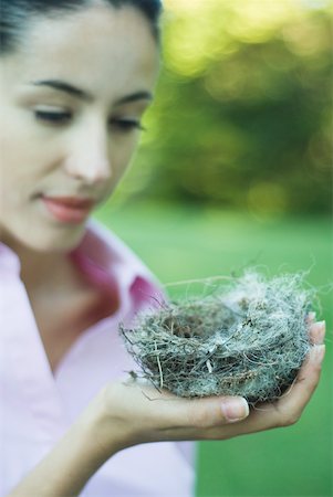 simsearch:633-01272536,k - Woman holding nest Stock Photo - Premium Royalty-Free, Code: 633-01573542