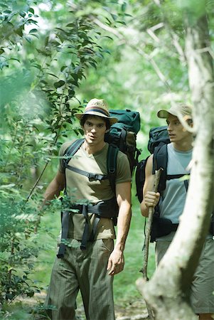 simsearch:633-01715612,k - Hikers walking through woods Stock Photo - Premium Royalty-Free, Code: 633-01573805
