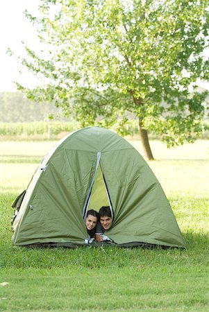 simsearch:633-01715612,k - Young campers peeking heads out of tent Stock Photo - Premium Royalty-Free, Code: 633-01714069