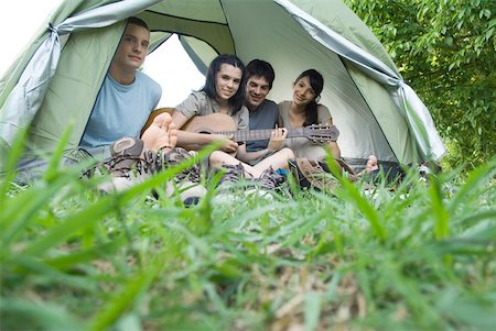 simsearch:633-01715612,k - Friends sitting in tent together Stock Photo - Premium Royalty-Free, Code: 633-01714075