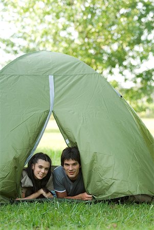 simsearch:633-01715612,k - Young campers peeking heads out of tent Stock Photo - Premium Royalty-Free, Code: 633-01714070