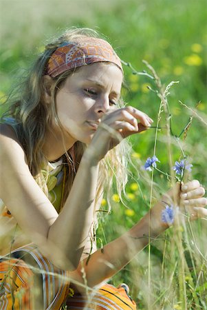 simsearch:633-01574151,k - Young woman picking wildflowers in field, cropped view, close-up Stock Photo - Premium Royalty-Free, Code: 633-01714122