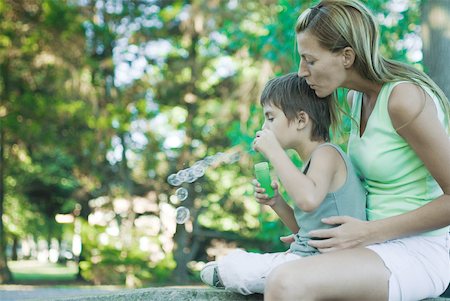 simsearch:632-05604245,k - Boy and mother blowing bubbles, side view Stock Photo - Premium Royalty-Free, Code: 633-01714814