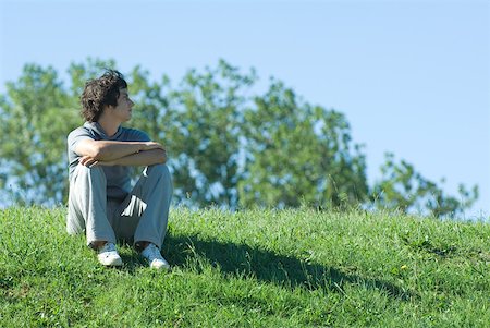 simsearch:633-01574151,k - Teen boy sitting on grassy hill, relaxing Stock Photo - Premium Royalty-Free, Code: 633-01715252