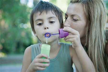 simsearch:632-05604245,k - Mother and son blowing bubbles together Stock Photo - Premium Royalty-Free, Code: 633-01715393