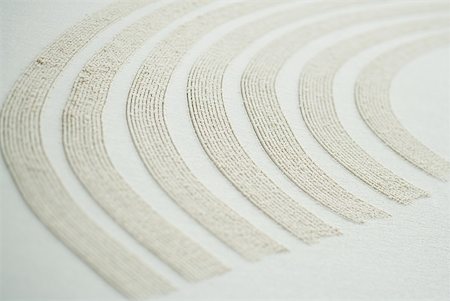 simsearch:633-01715488,k - Curve pattern traced in sand, close-up Stock Photo - Premium Royalty-Free, Code: 633-01715482