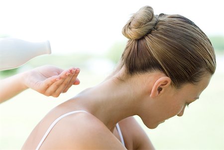 Woman having massage, massage therapist pouring oil into hand Stock Photo - Premium Royalty-Free, Code: 633-01715587