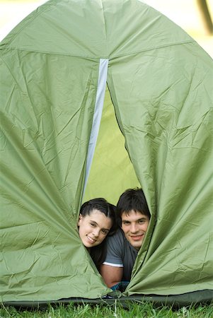 simsearch:633-01715612,k - Young campers peeking heads out of tent Stock Photo - Premium Royalty-Free, Code: 633-01715605