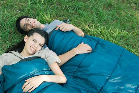 simsearch:633-01715612,k - Young campers in sleeping bags Stock Photo - Premium Royalty-Free, Code: 633-01715608