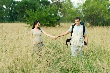 simsearch:633-01715612,k - Young couple going for hike, holding hands Stock Photo - Premium Royalty-Free, Code: 633-01715618