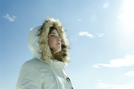 simsearch:633-01574151,k - Teen girl wearing parka, low angle view Stock Photo - Premium Royalty-Free, Code: 633-01713687