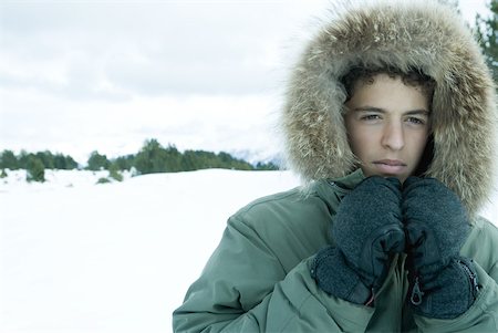 simsearch:633-01574151,k - Teen boy wearing parka in snowy landscape Stock Photo - Premium Royalty-Free, Code: 633-01713700