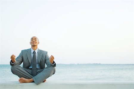 simsearch:640-03265635,k - Businessman sitting in lotus position at the beach, eyes closed Stock Photo - Premium Royalty-Free, Code: 633-01992762