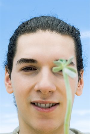 sedum - Young man with succulent plant Stock Photo - Premium Royalty-Free, Code: 633-02065765