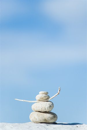 stacked stone - Stones and coral piled up, twig stuck between two pieces of coral Stock Photo - Premium Royalty-Free, Code: 633-02345738